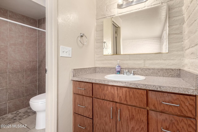 bathroom with toilet, walk in shower, tile patterned floors, and vanity