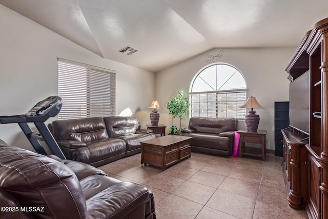 tiled living room featuring lofted ceiling