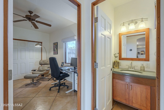 tiled office featuring sink and ceiling fan