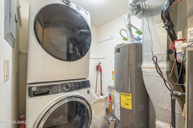 washroom with stacked washer and dryer and gas water heater