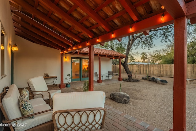 patio terrace at dusk featuring outdoor lounge area