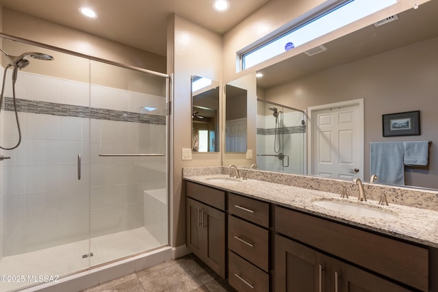 bathroom with vanity and an enclosed shower