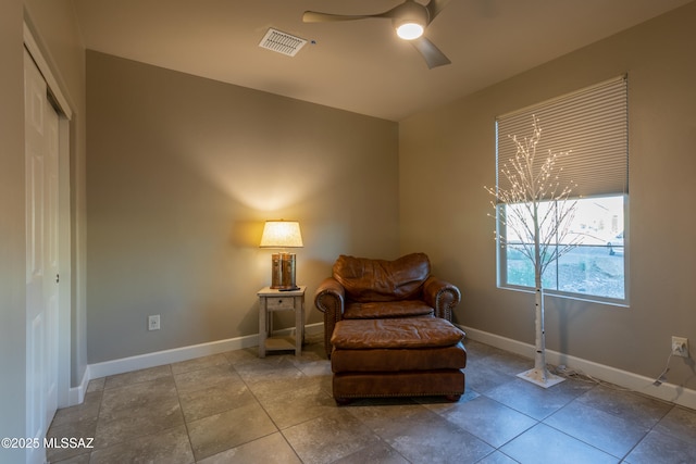 living area featuring ceiling fan