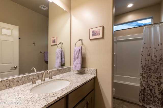 full bathroom with vanity, toilet, and shower / tub combo