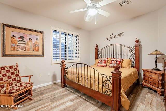 bedroom with ceiling fan and hardwood / wood-style floors