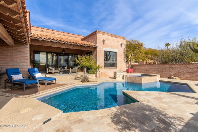 view of swimming pool featuring an in ground hot tub, ceiling fan, and a patio