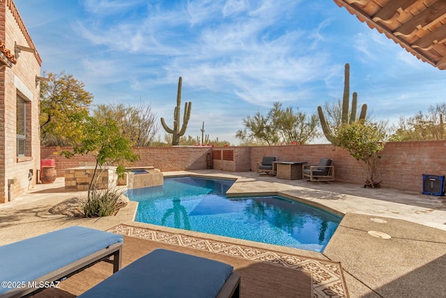 view of pool featuring an in ground hot tub and a patio area