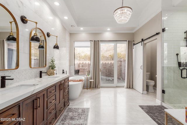 full bathroom with toilet, ornamental molding, an inviting chandelier, vanity, and separate shower and tub