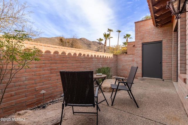 view of patio / terrace with a mountain view