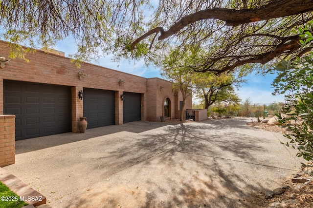 view of side of property featuring a garage