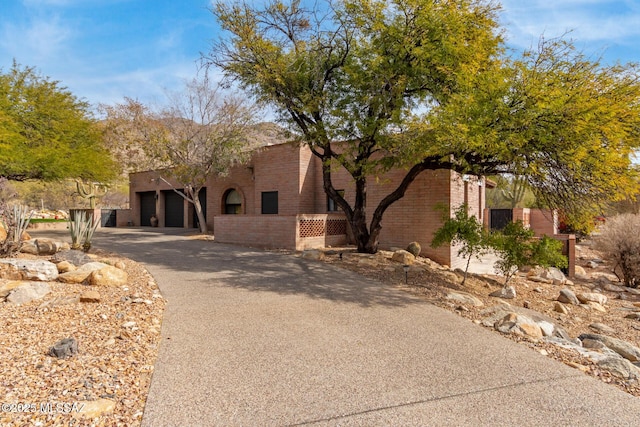 southwest-style home with a garage