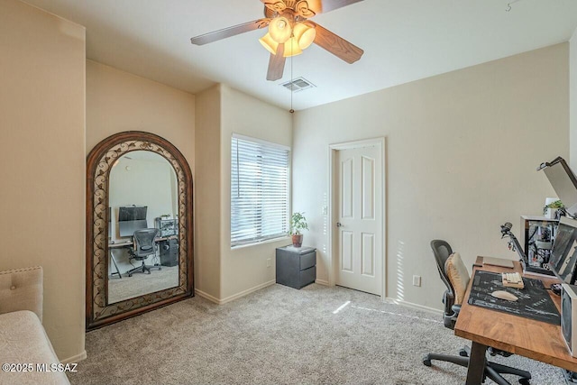 carpeted office featuring a ceiling fan, baseboards, and visible vents