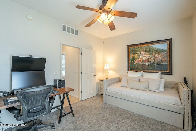 bedroom with ceiling fan, visible vents, and light carpet