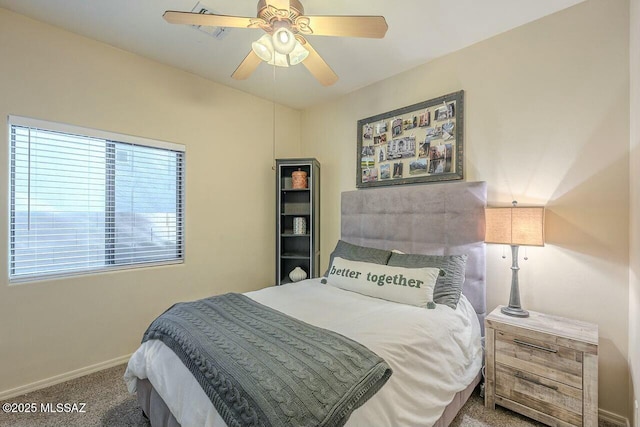 bedroom with baseboards, carpet flooring, and a ceiling fan
