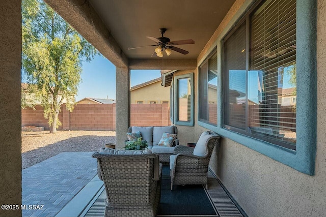 view of patio / terrace featuring a ceiling fan, a fenced backyard, and outdoor lounge area