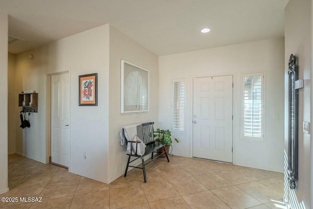 foyer entrance featuring light tile patterned floors