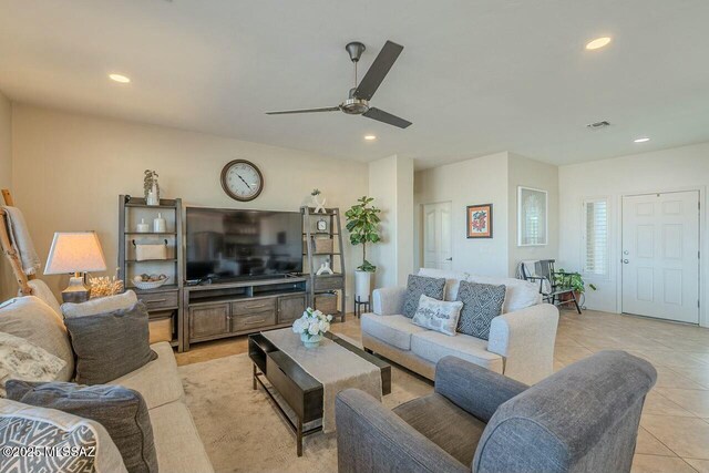 living room with light tile patterned floors, recessed lighting, and ceiling fan