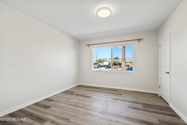 unfurnished room featuring light wood-type flooring