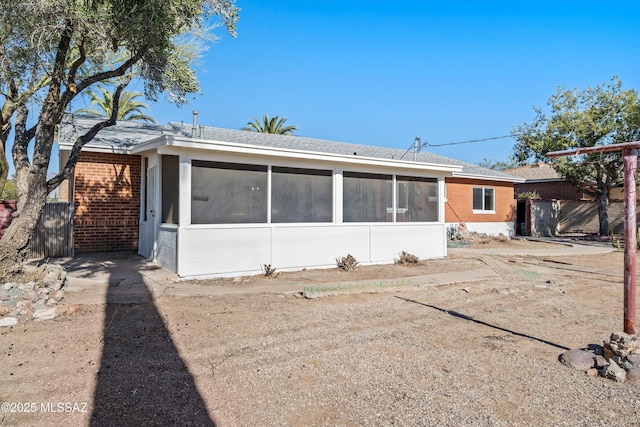 rear view of house with a sunroom