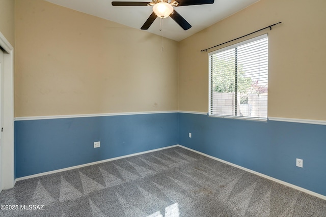 empty room featuring ceiling fan and carpet floors