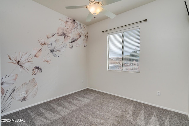 spare room with carpet floors and ceiling fan