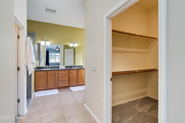 bathroom with vanity and tile patterned flooring