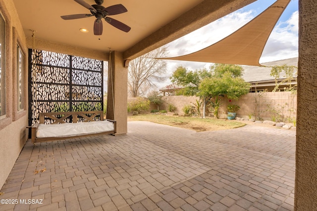 view of patio / terrace featuring ceiling fan