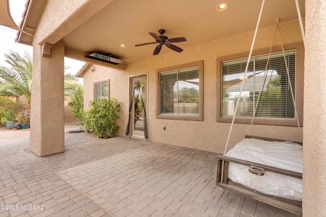 view of patio / terrace featuring ceiling fan