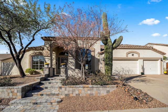 mediterranean / spanish-style home with a garage