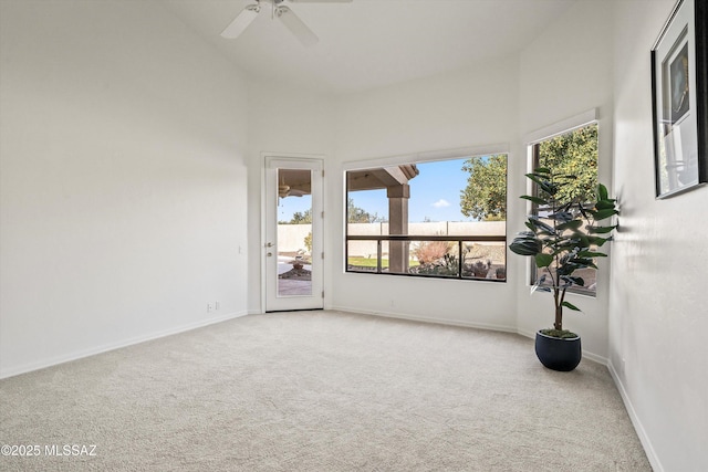 unfurnished sunroom with lofted ceiling and ceiling fan