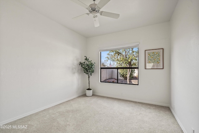 unfurnished room featuring light colored carpet and ceiling fan