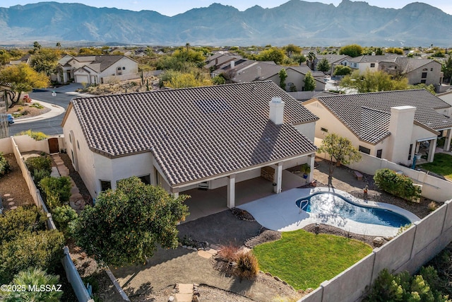 birds eye view of property with a mountain view