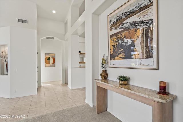 corridor featuring light tile patterned flooring