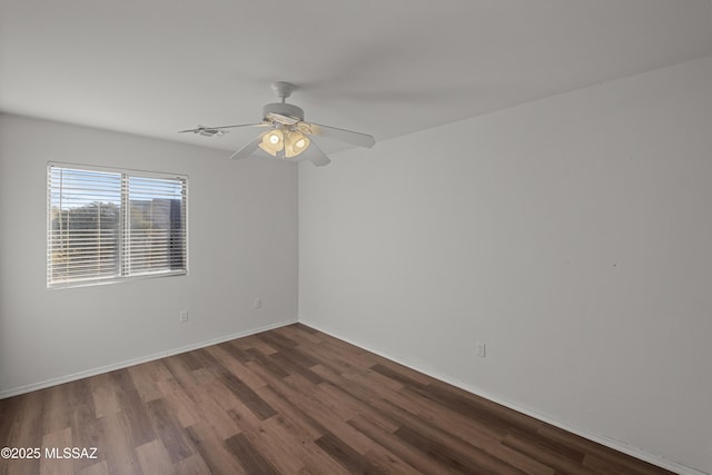 spare room with wood-type flooring and ceiling fan