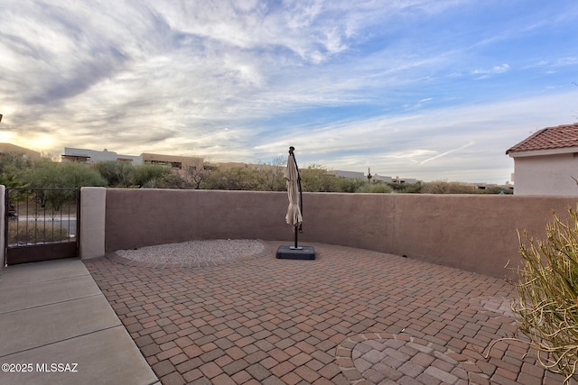 view of patio terrace at dusk