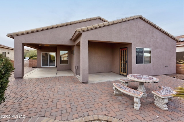 back of property featuring a patio area