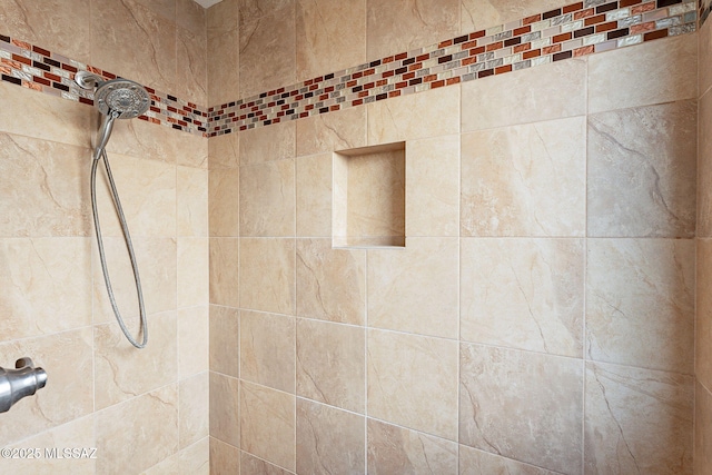 room details with a tile shower