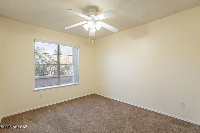 unfurnished room with a textured ceiling, carpet floors, and ceiling fan