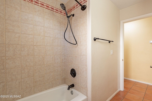 bathroom with tile patterned flooring and tiled shower / bath combo