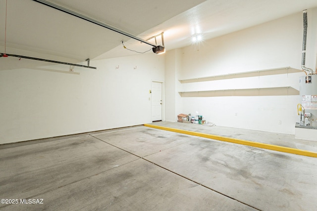 garage featuring a garage door opener and gas water heater