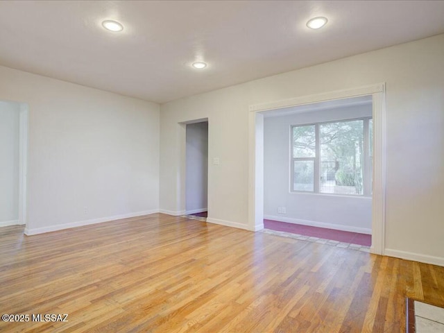 spare room with light hardwood / wood-style floors