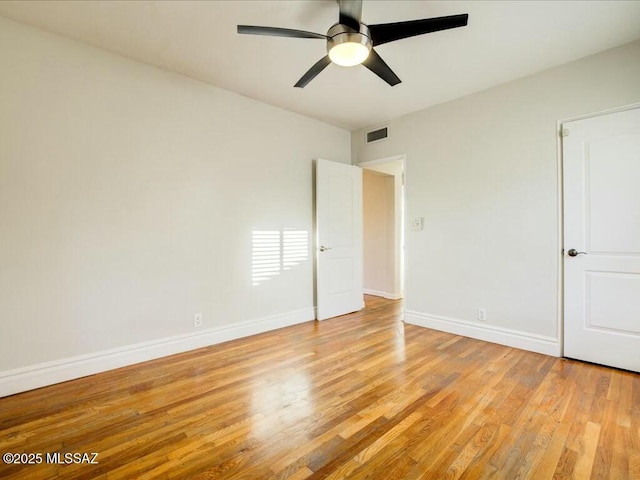 unfurnished room featuring light wood-type flooring and ceiling fan