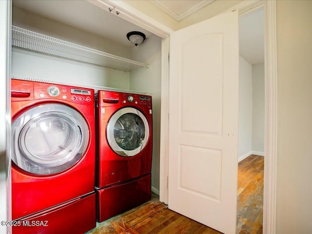 laundry room with dark hardwood / wood-style floors and washer and dryer