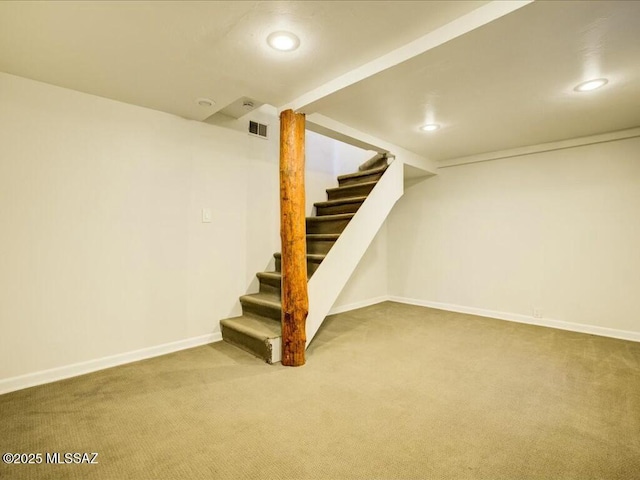 basement with carpet flooring