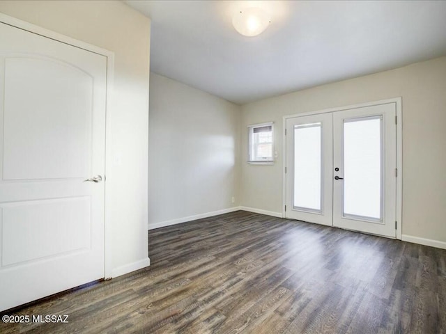 unfurnished room featuring french doors and dark hardwood / wood-style flooring