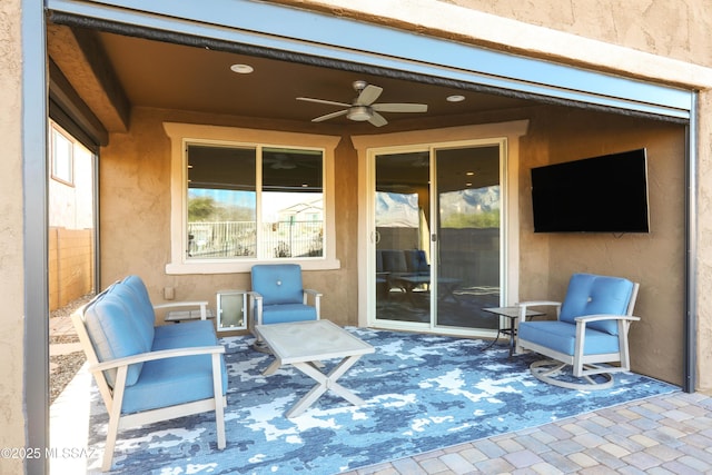 view of patio / terrace featuring ceiling fan