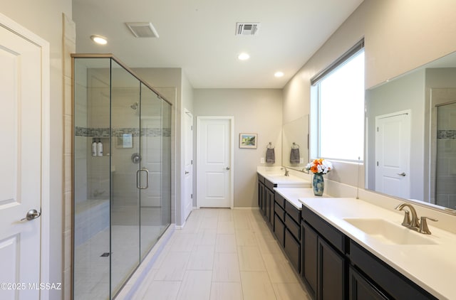 bathroom with vanity and walk in shower