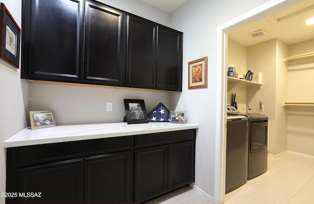 laundry room featuring washer and clothes dryer