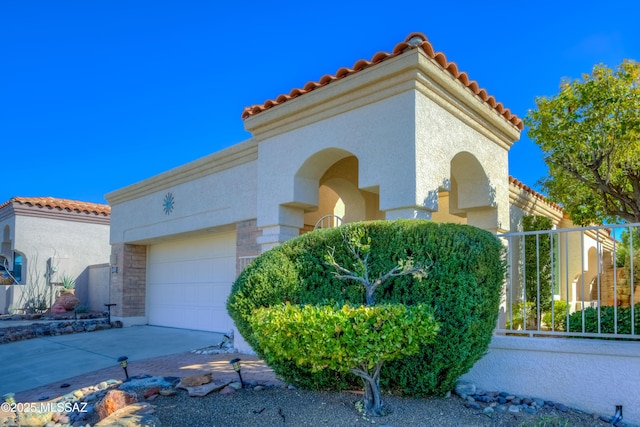 view of side of home with a garage