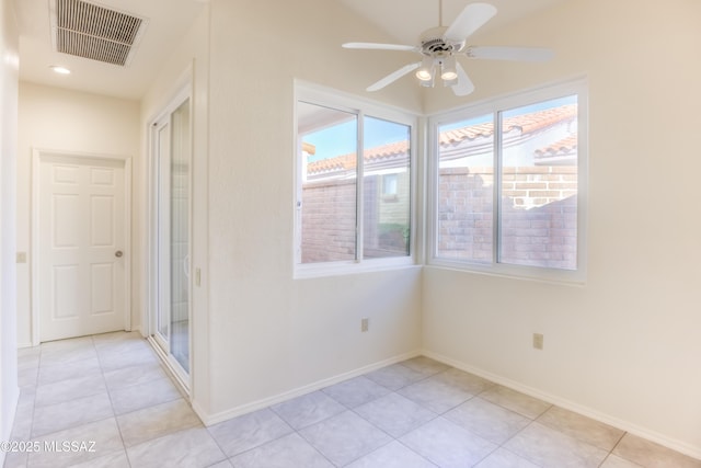 unfurnished room featuring ceiling fan and light tile patterned flooring